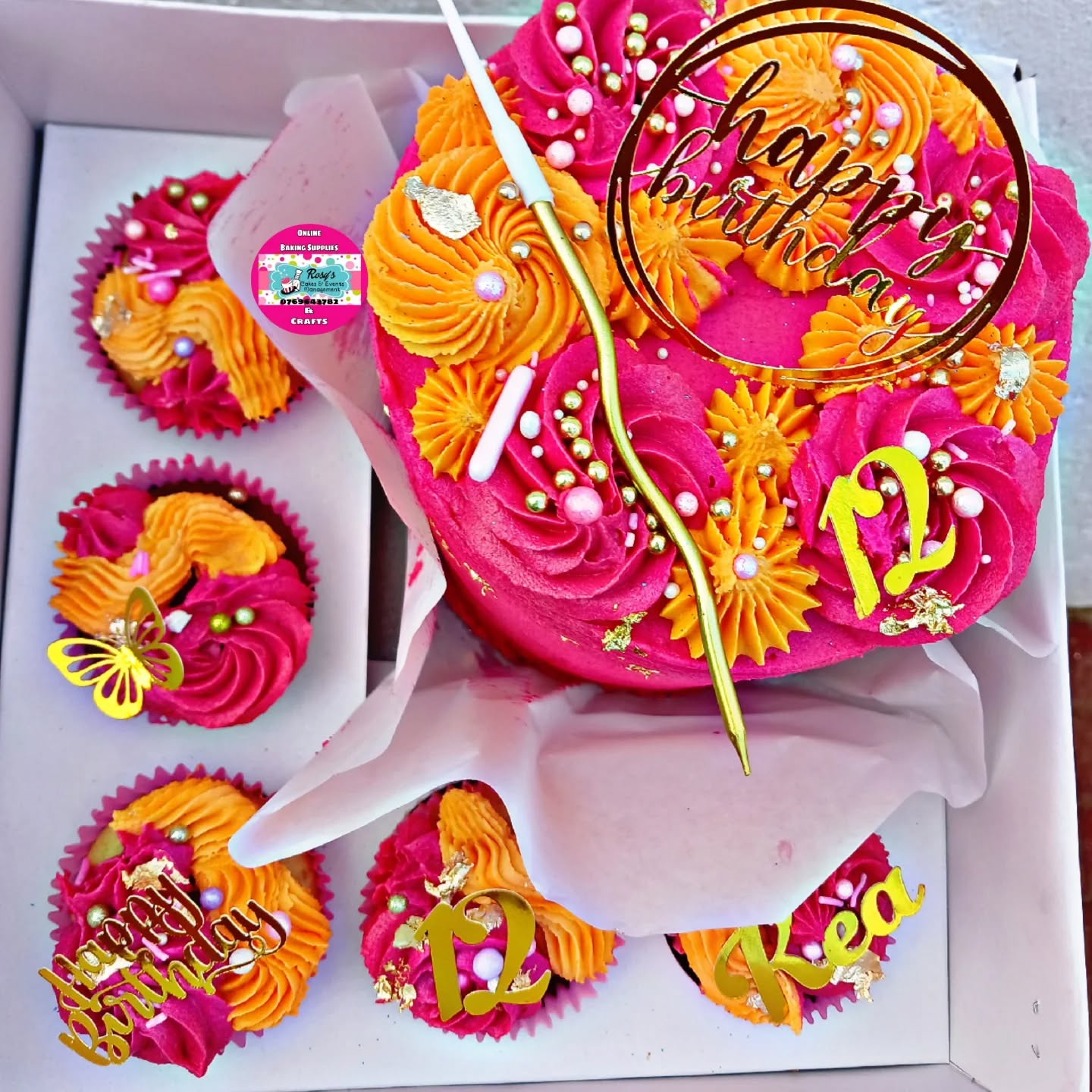 A pink and orange floral buttercream birthday cake made by Rosy's Cakes and Events