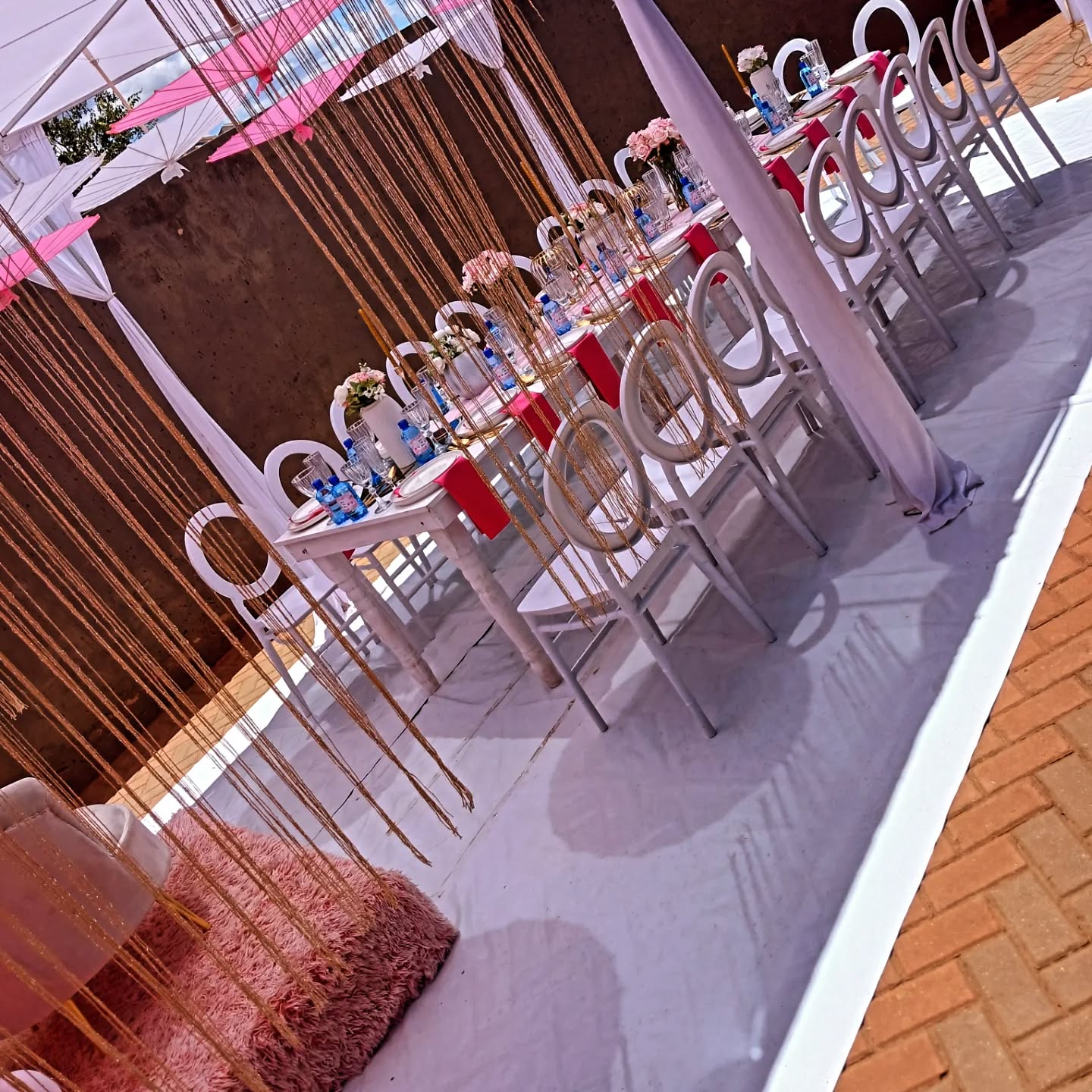 An outdoor party table setup styled by Rosy's Cakes and Events