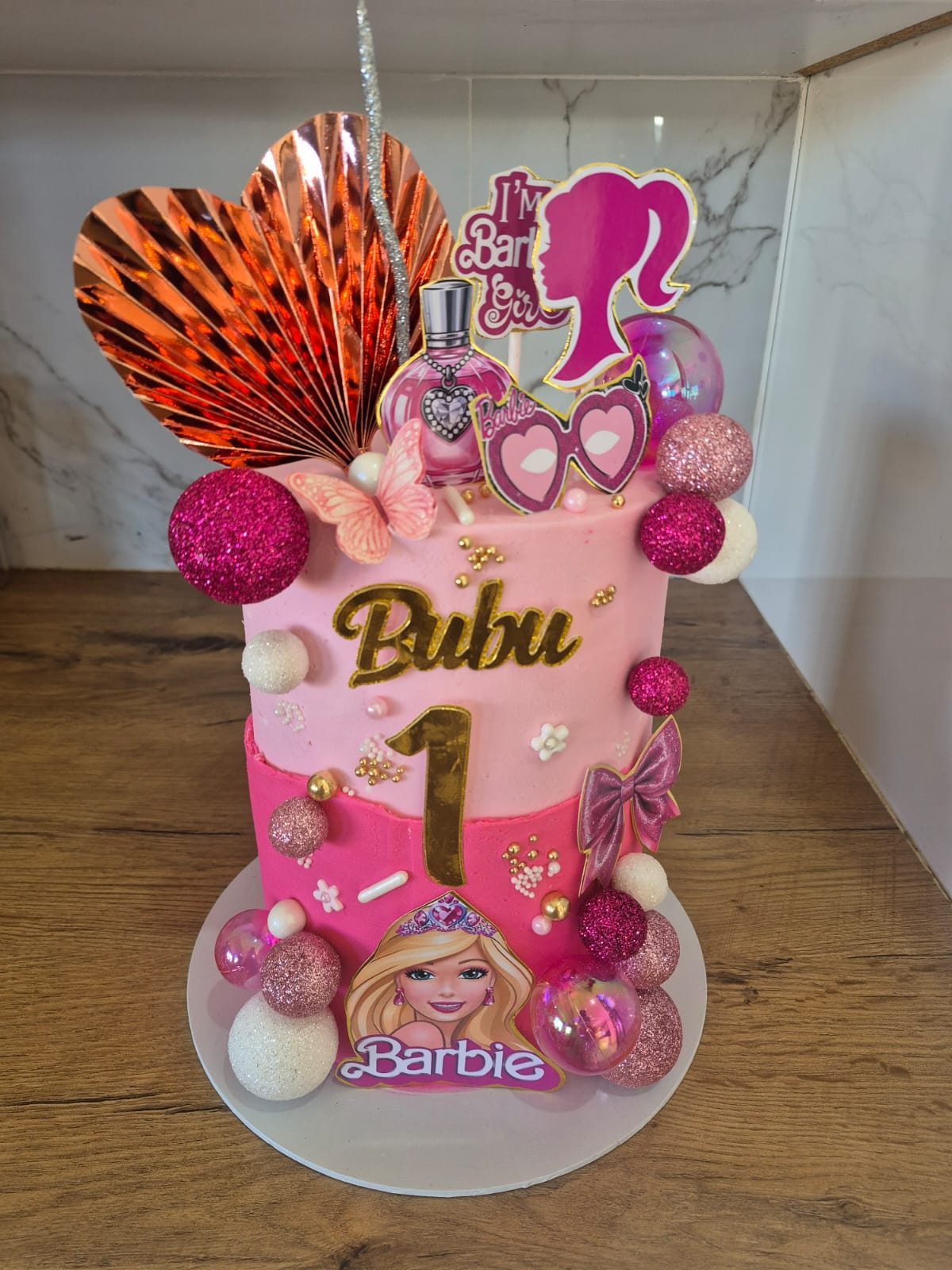 A pink Barbie themed first birthday tower cake, a recent Rosy's Cakes and Events creation