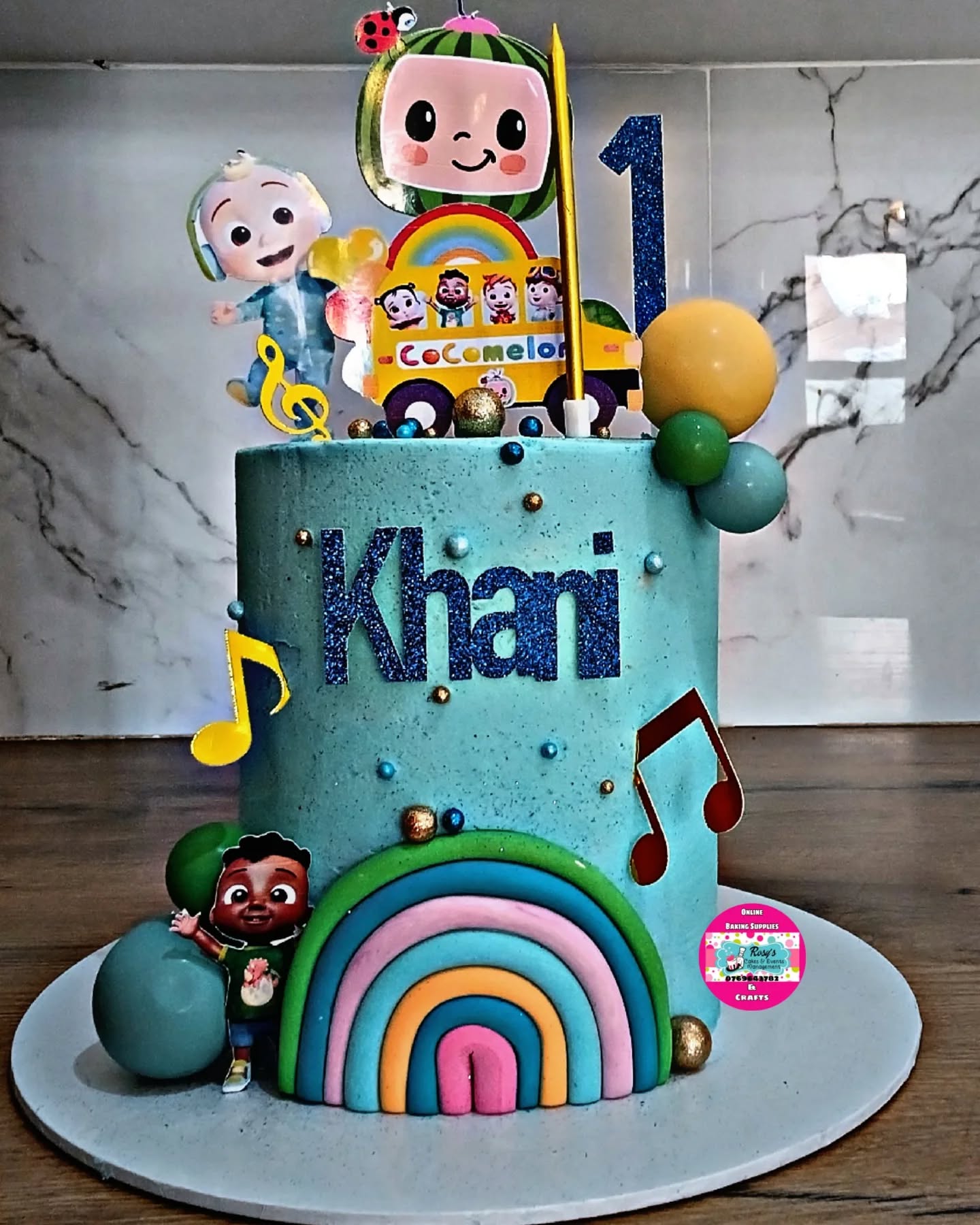 Blue Cocomelon Rainbow Cake by Rosy's Cakes and Events