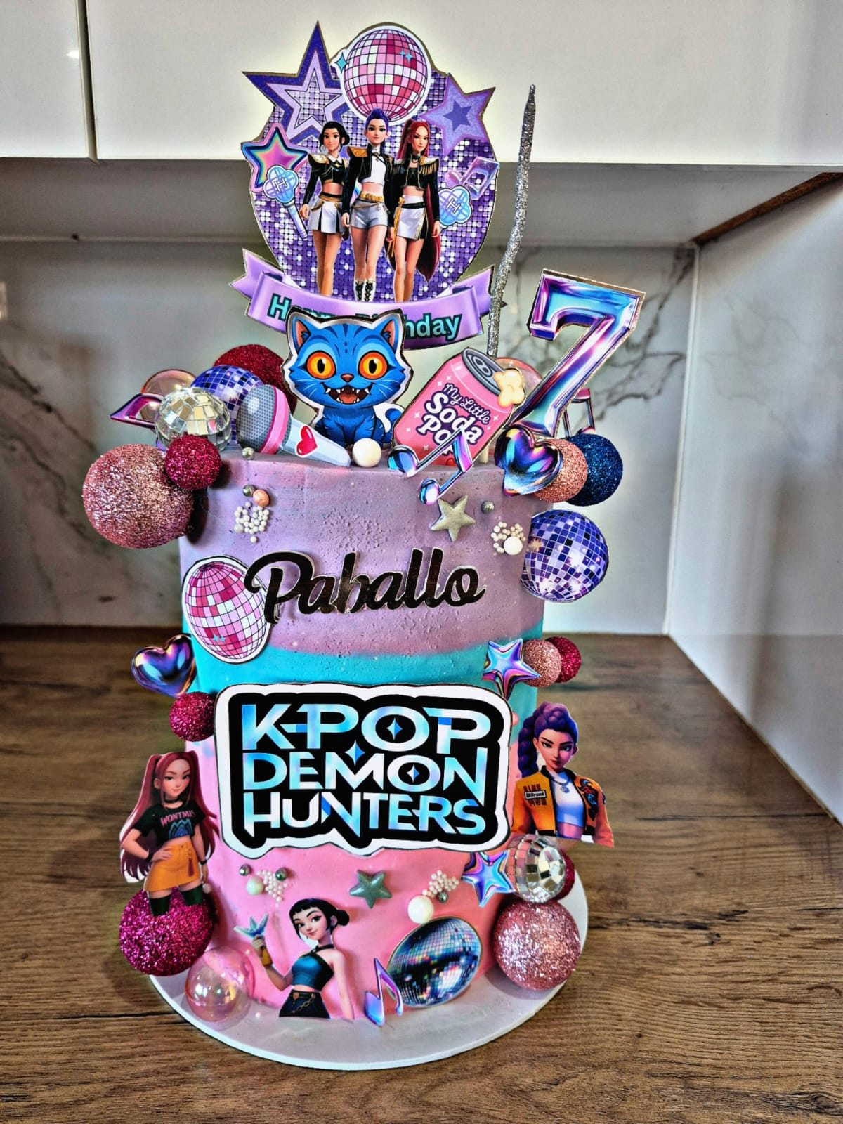 A K-pop Demon Hunters themed tower birthday cake, a recent Rosy's Cakes and Events creation