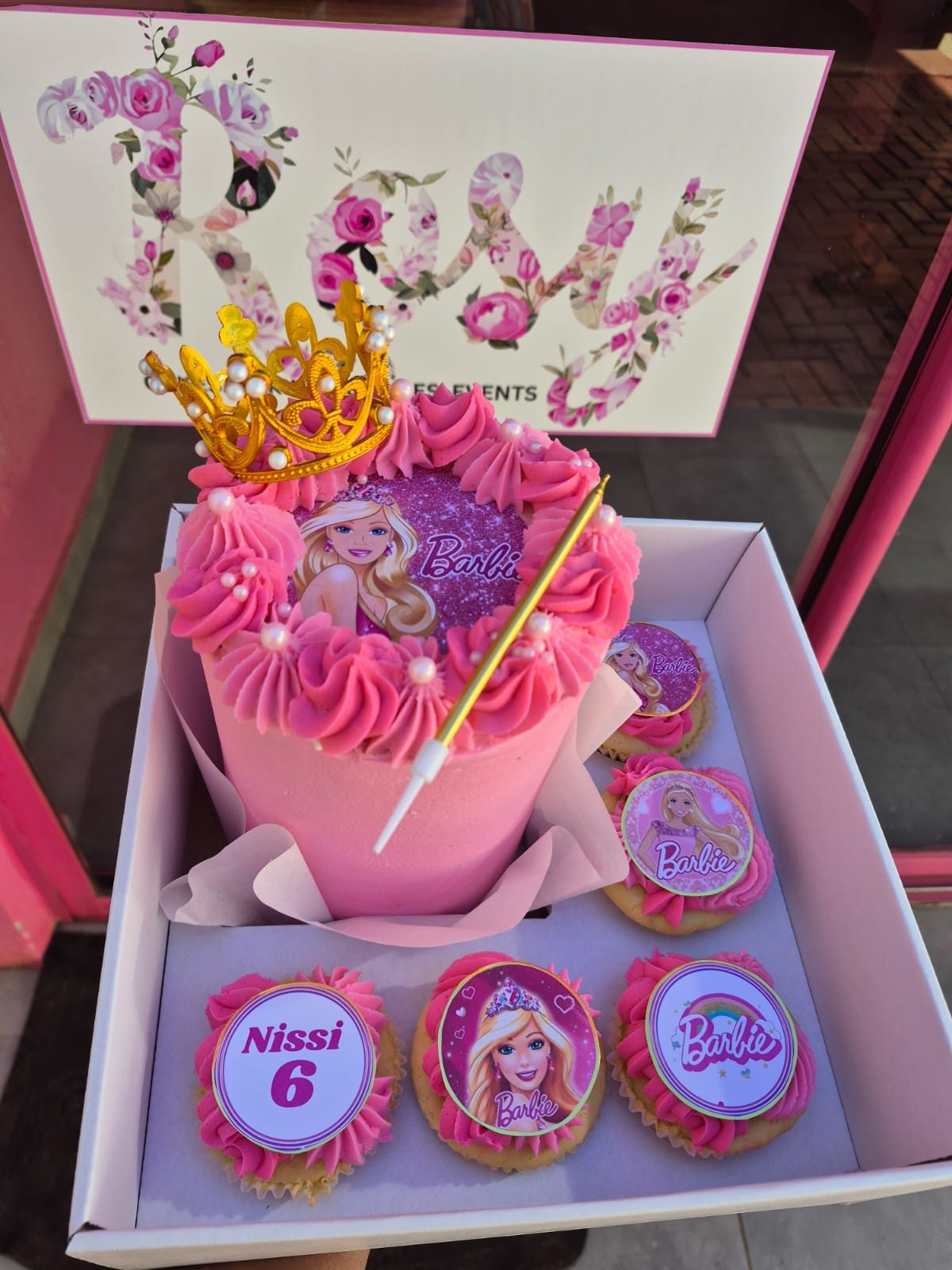 A pink Barbie-themed bento cake with matching cupcakes, a recent Rosy's Cakes and Events creation
